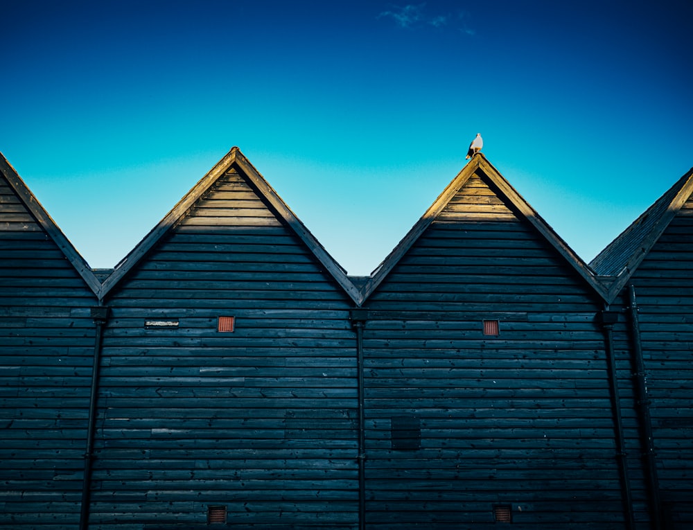 a row of wooden buildings sitting next to each other