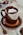 a cup of hot chocolate with marshmallows on a saucer