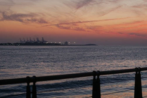 Sunset view of a water treatment plant by the ocean