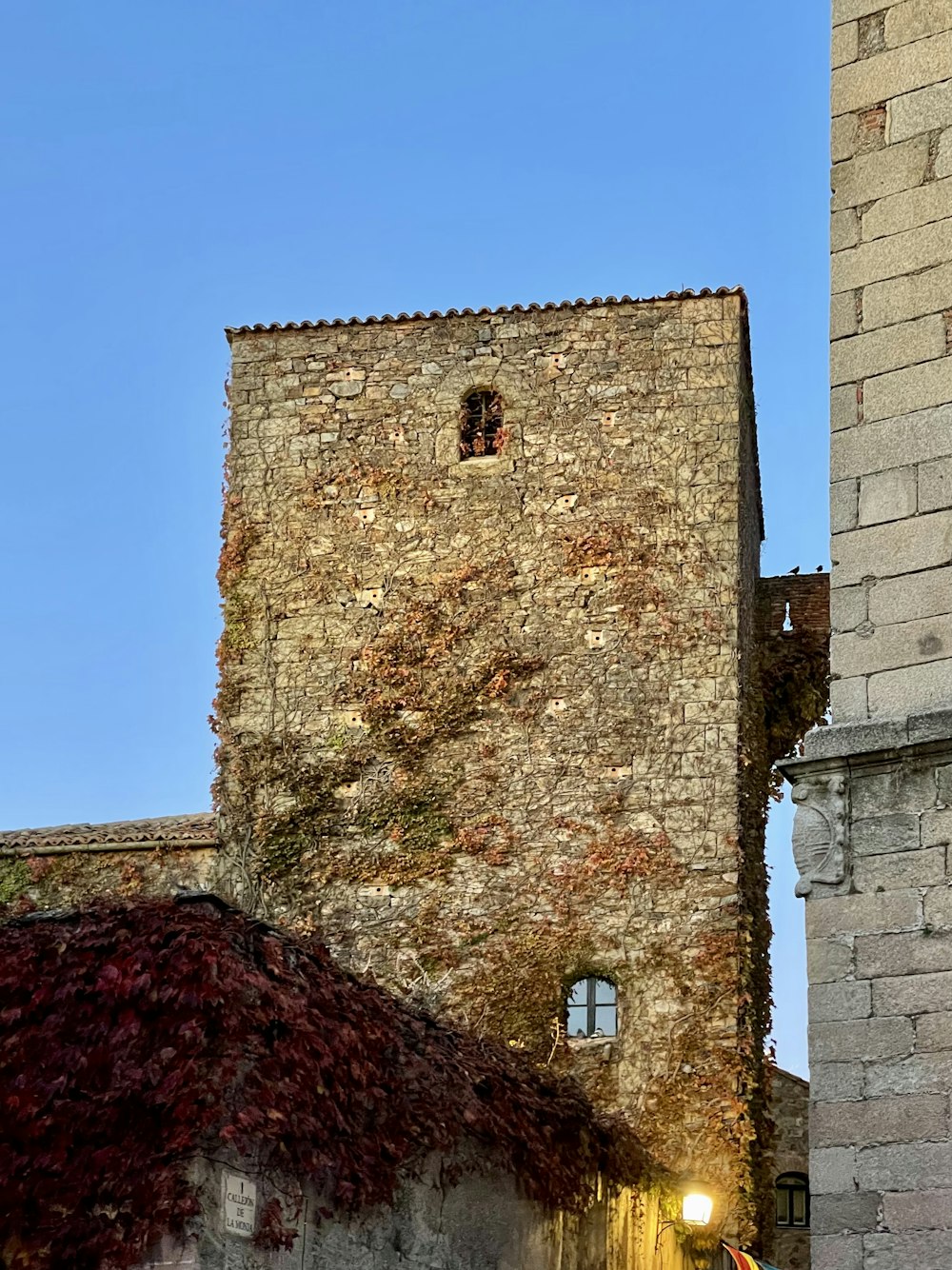 a tall brick building with a clock on it's face