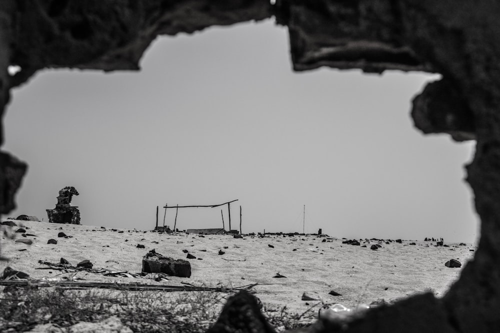 a black and white photo of a beach