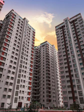 Modern residential apartment buildings representing property consultation services.