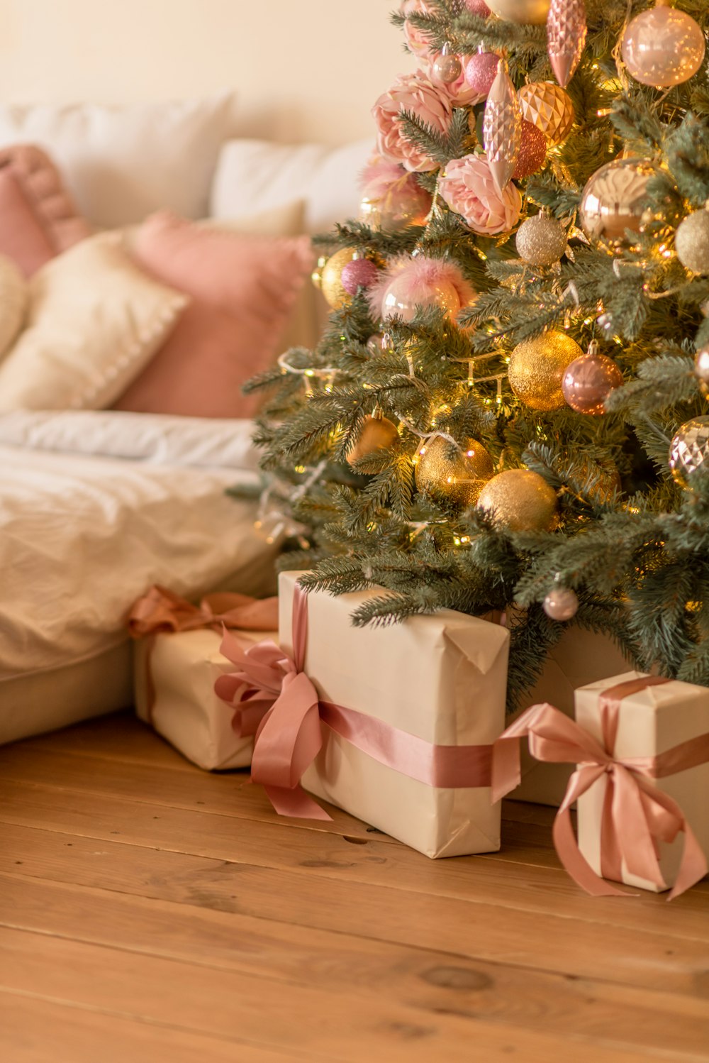 a small christmas tree with presents under it