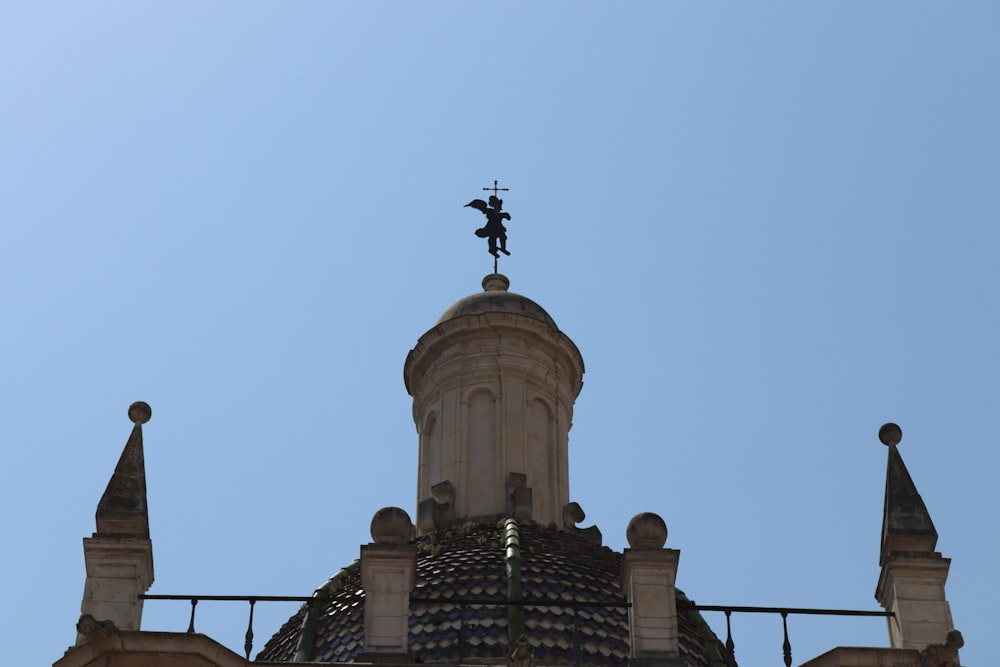 a church steeple with a cross on top