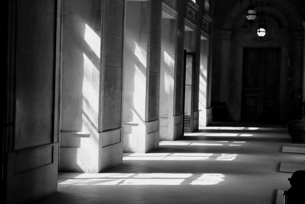 a black and white photo of a hallway