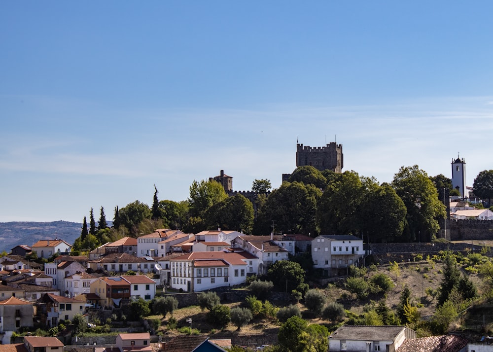 a small town with a castle on top of it