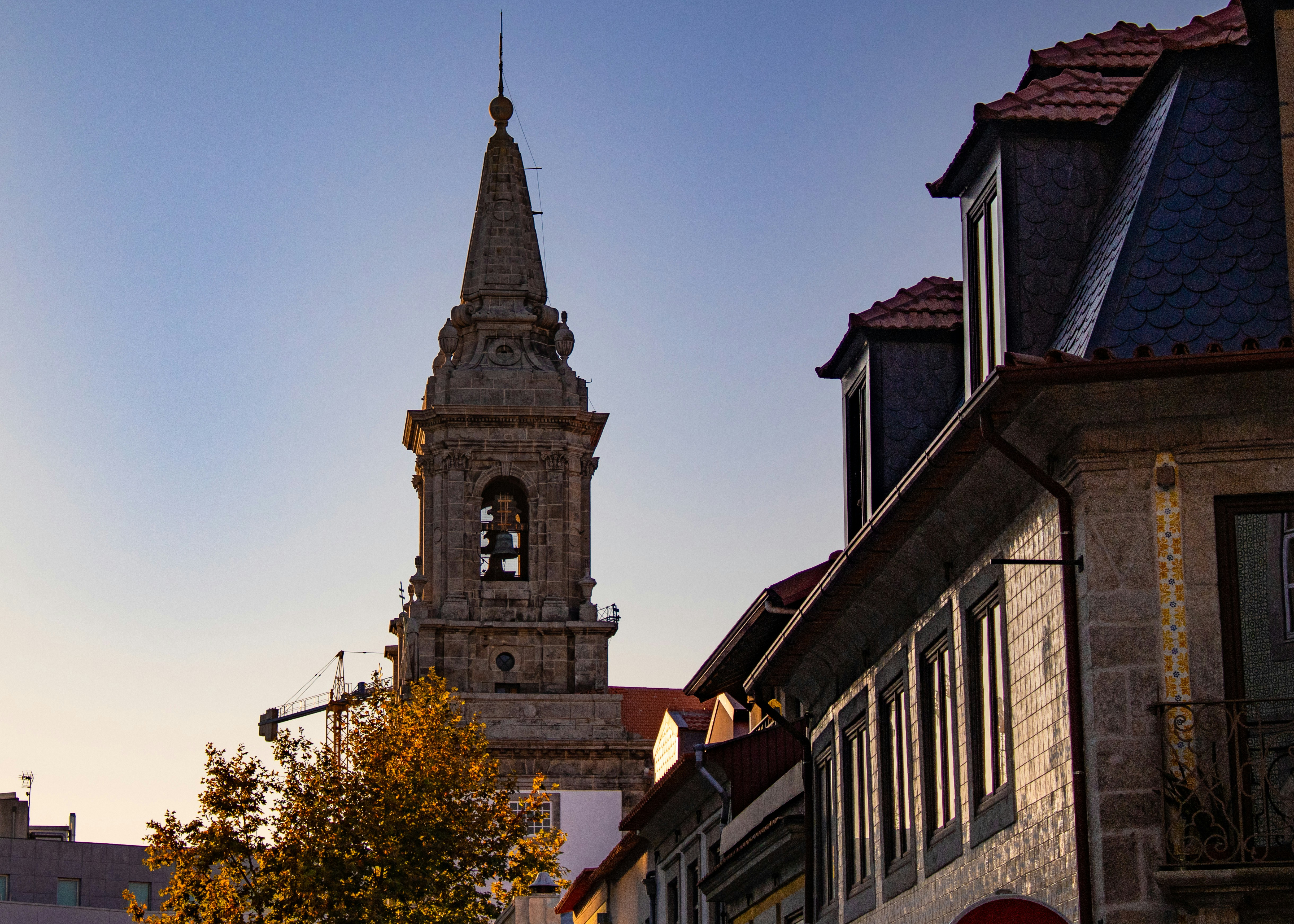 a tall clock tower towering over a city