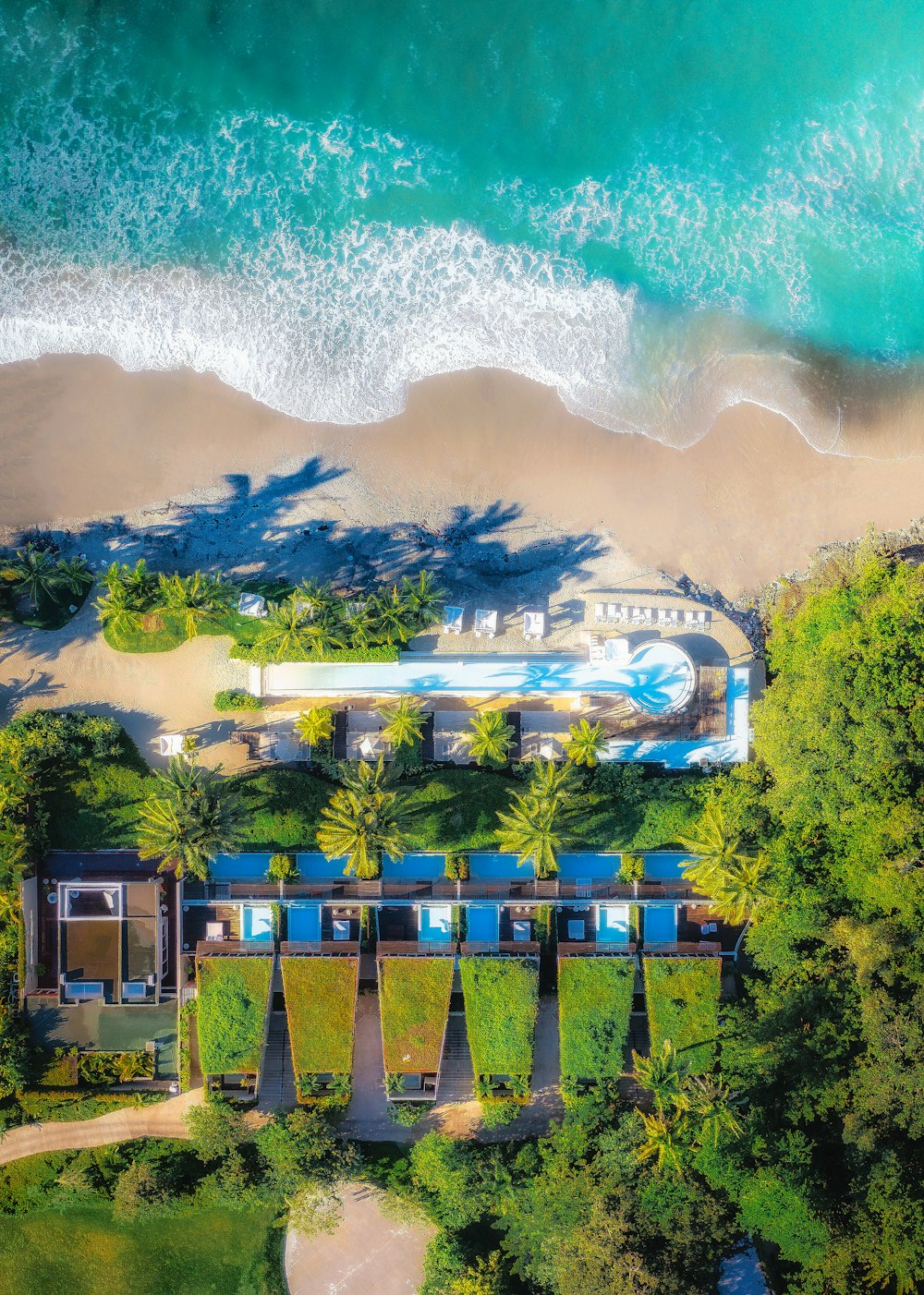 a bird's eye view of a resort on the beach