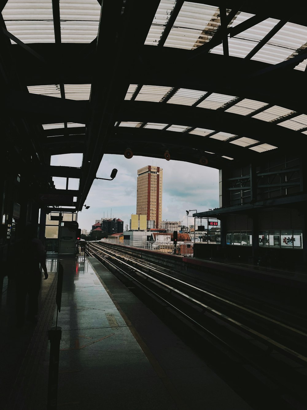 a train station with a train on the tracks