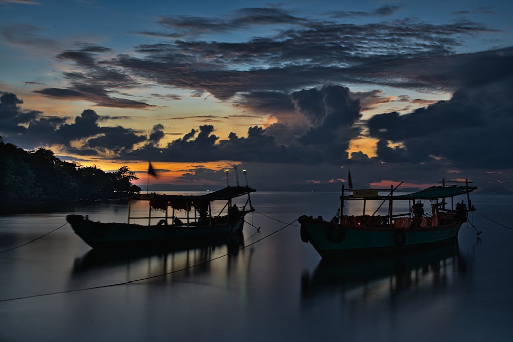 a couple of boats that are sitting in the water