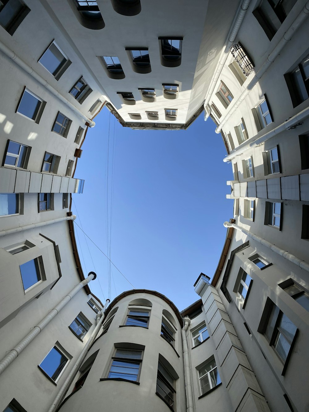 looking up at a tall building from the ground