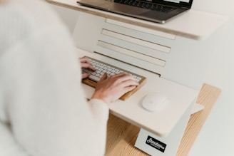 a person is typing on a computer keyboard