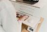 a person is typing on a computer keyboard
