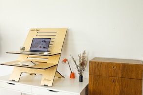 a desk with a computer on top of it
