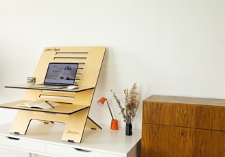 a desk with a computer on top of it