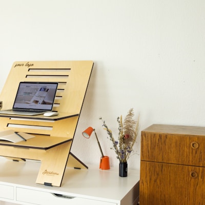 a desk with a computer on top of it