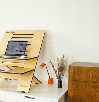 a desk with a computer on top of it