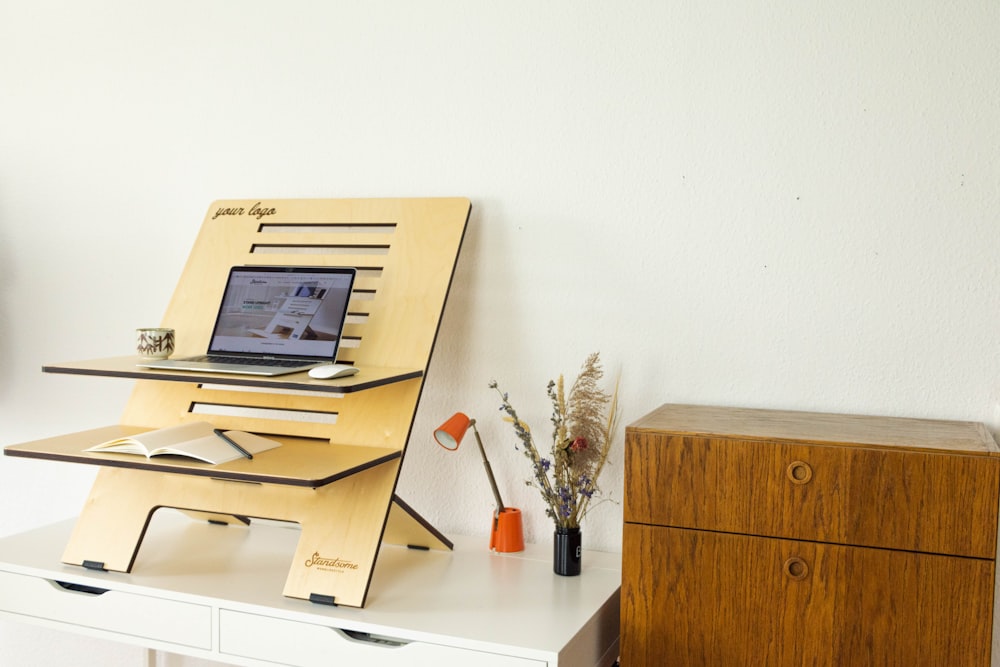 a desk with a computer on top of it