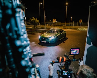 a car driving down a street at night