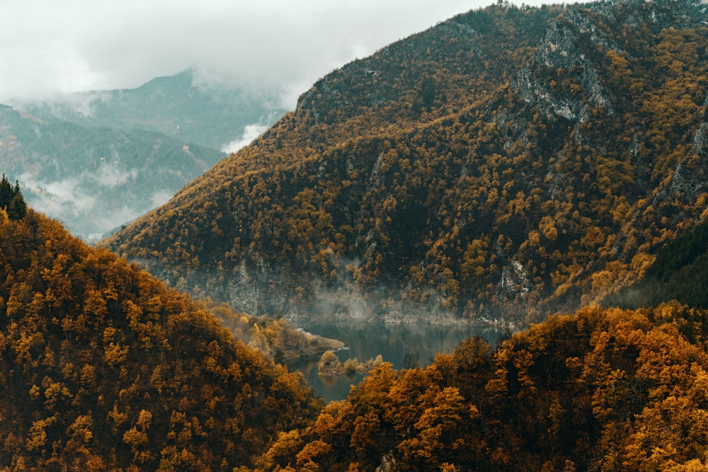 a view of a mountain range with a lake in the middle of it