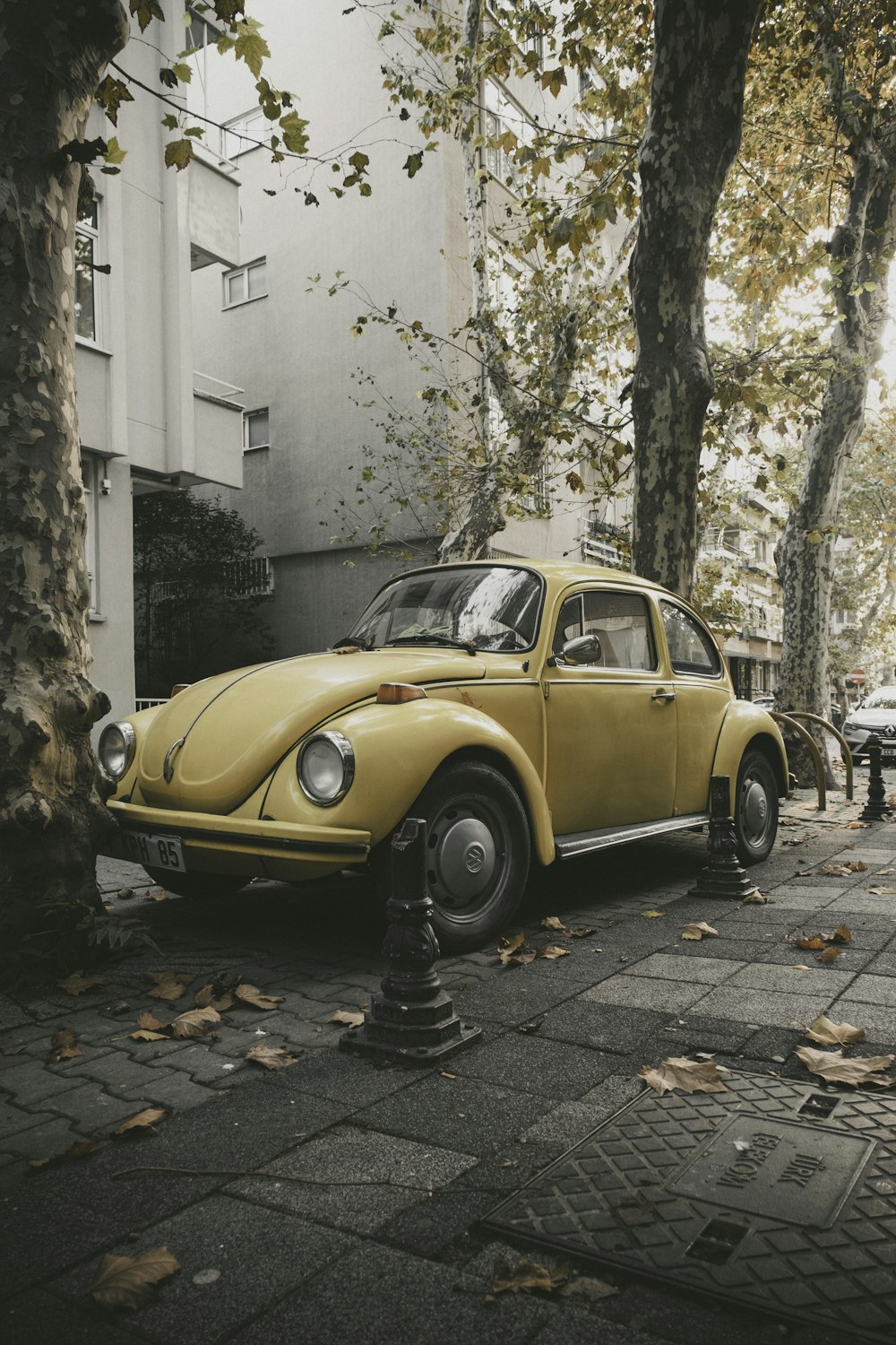 a yellow car parked on the side of the road