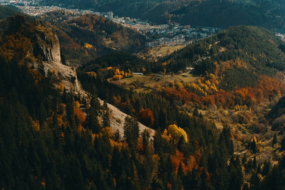 a scenic view of a city in the mountains