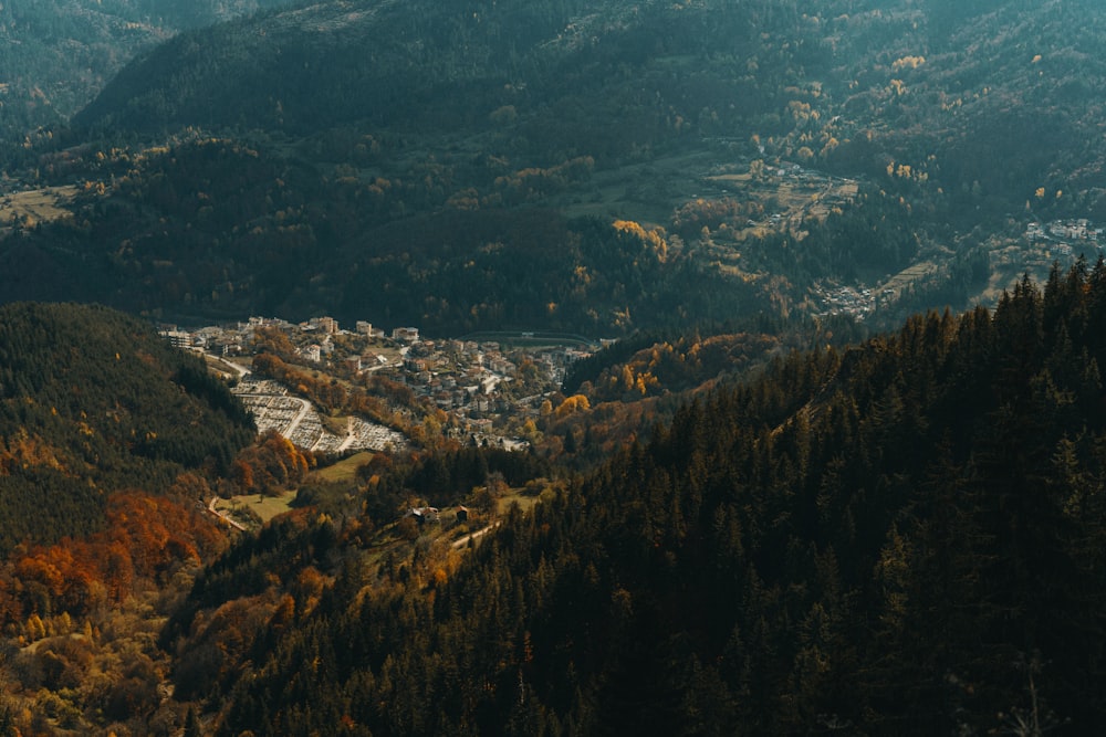 a view of a town nestled in the mountains