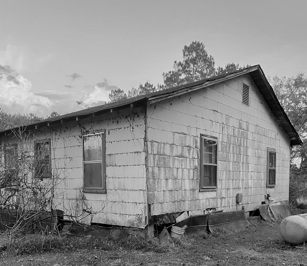 a black and white photo of an old house