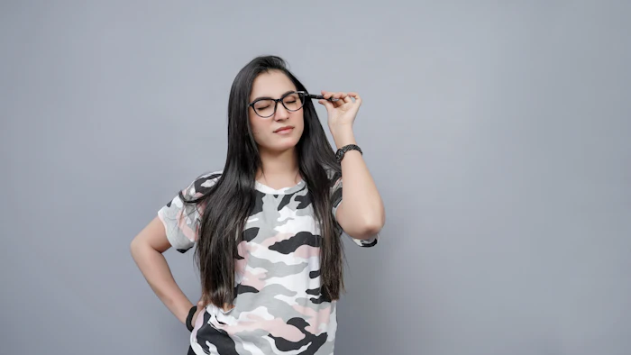 Illustrative stock portrait — Pakistani woman wearing glasses