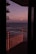 Cozy balcony view of the ocean near the Ingleses apartment with sunset colors.