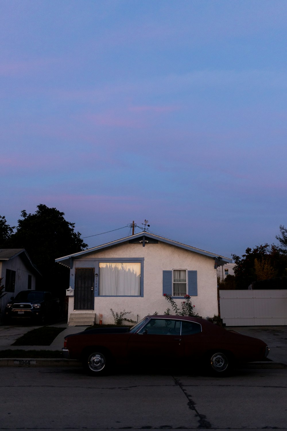 a car is parked in front of a house