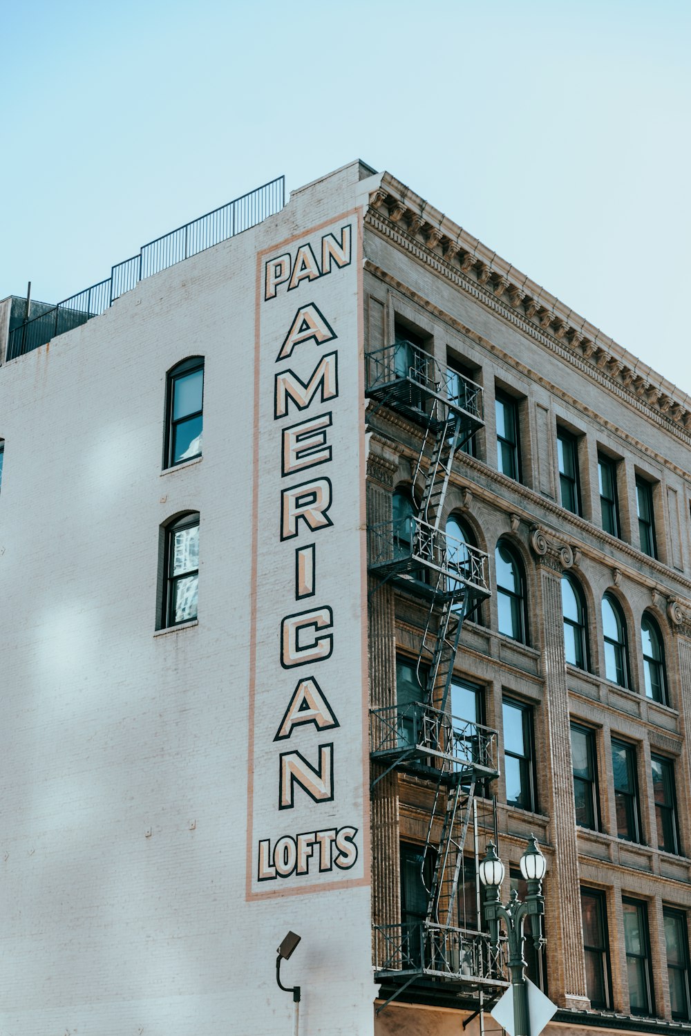 a tall building with a sign on the side of it