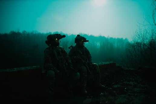 a couple of soldiers sitting next to each other
