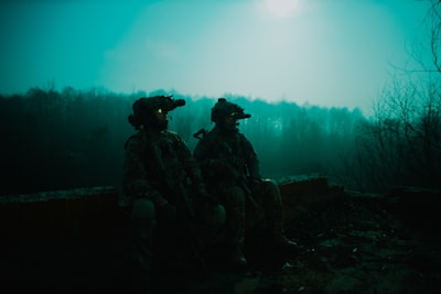 a couple of soldiers sitting next to each other