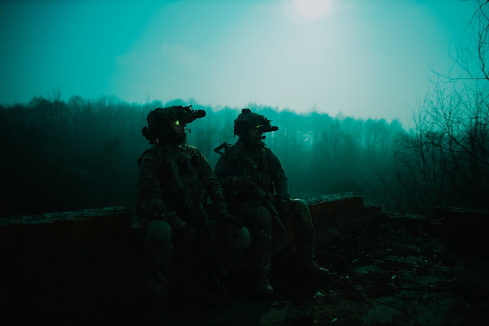 a couple of soldiers sitting next to each other