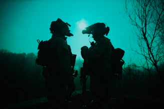 a couple of soldiers standing next to each other