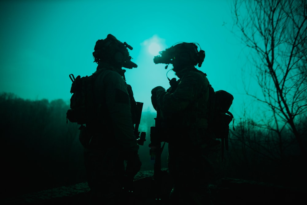 a couple of soldiers standing next to each other