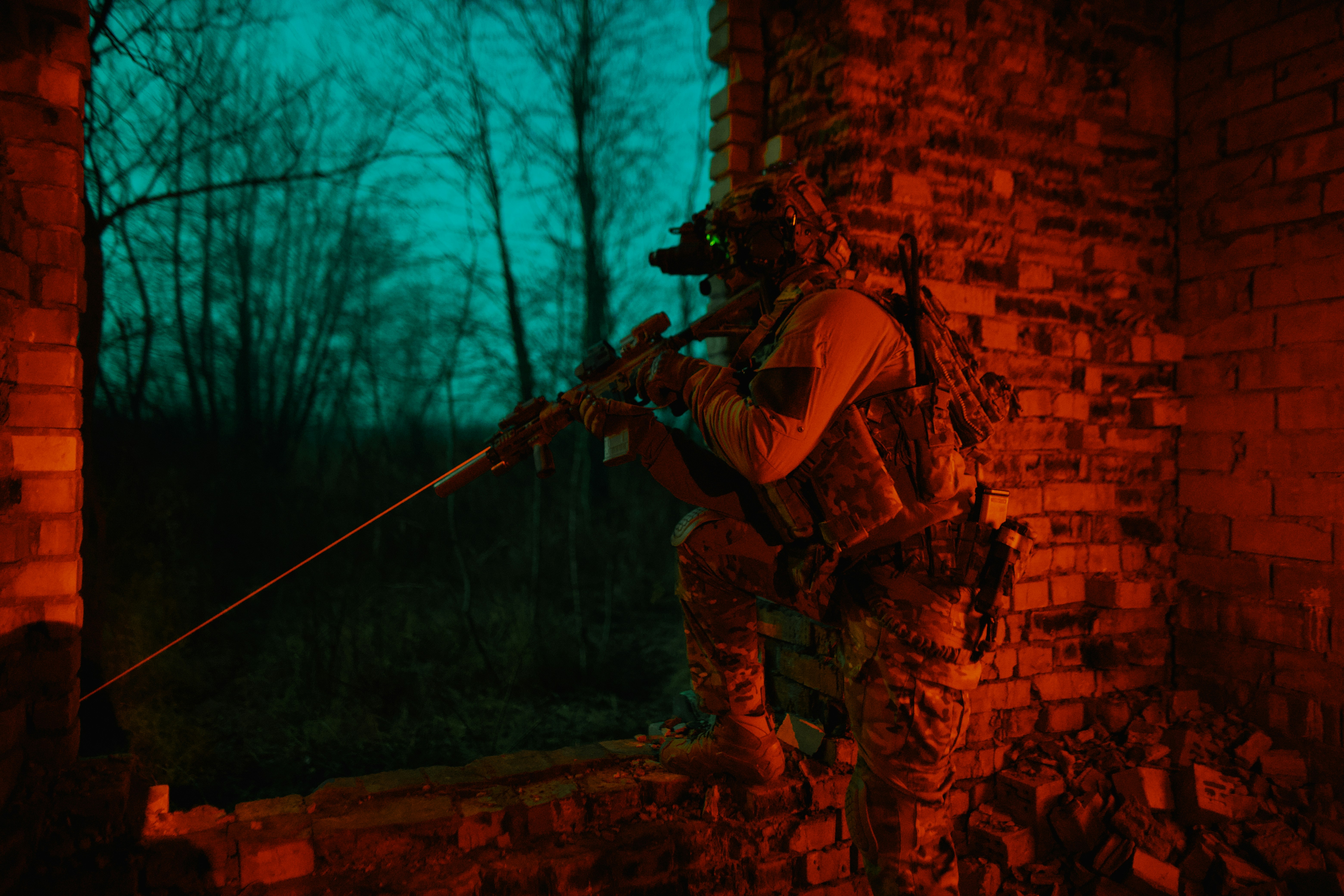 Soldiers with a rifle at night