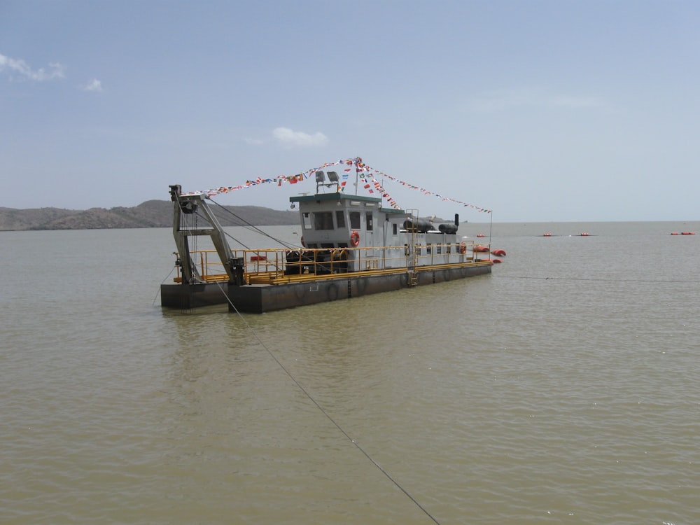 a large boat floating on top of a large body of water