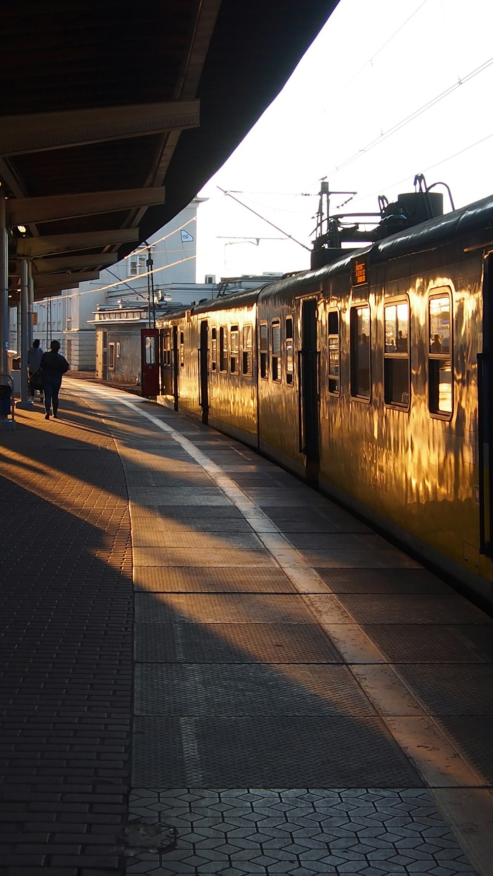 a train parked at a train station next to a platform