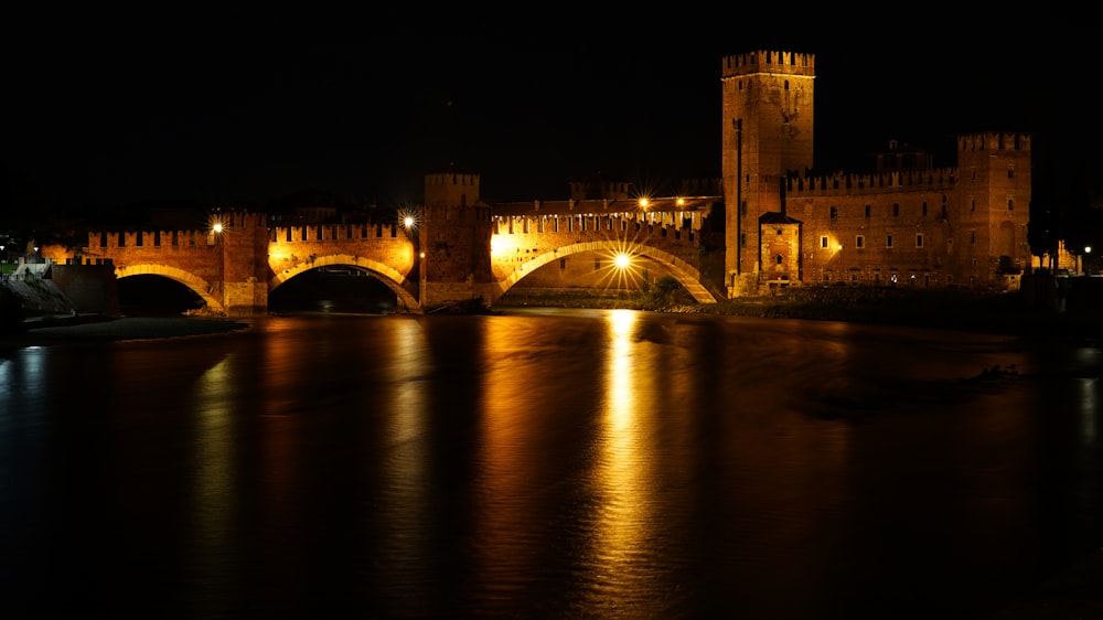 a bridge over a body of water at night