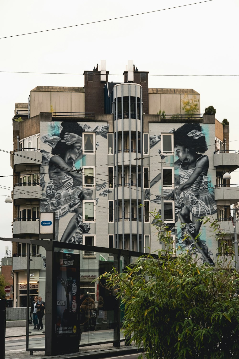 a tall building with a mural on the side of it