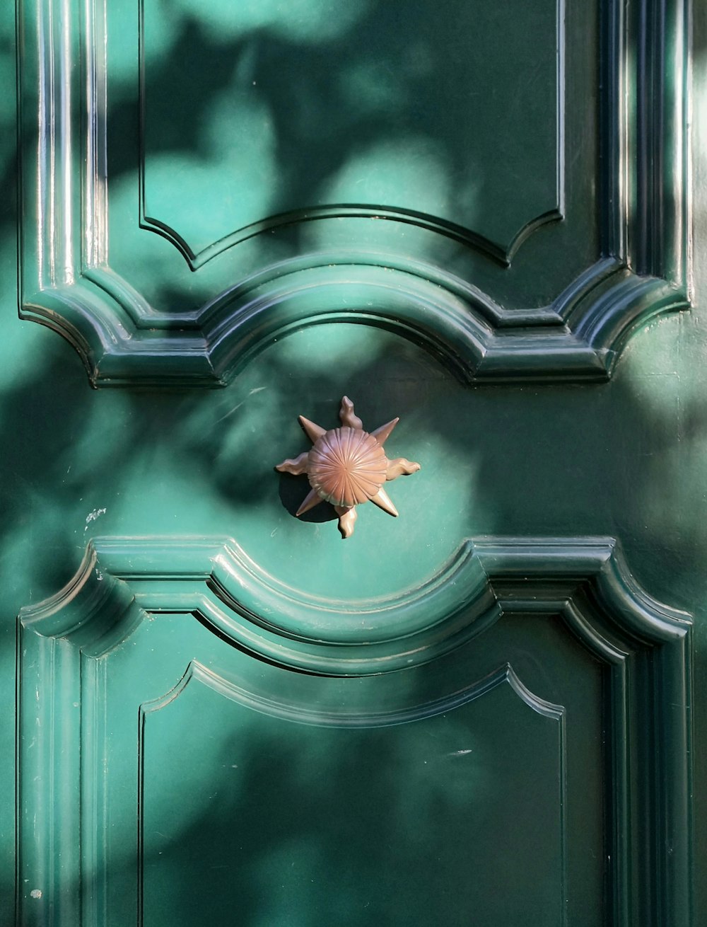 a green door with a star decoration on it