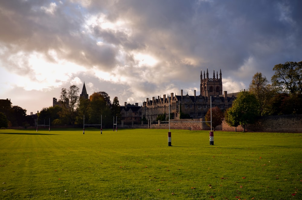 a soccer field with a castle in the background