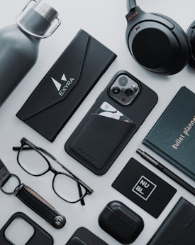 A collection of stylish merchandise displayed on a dark background.