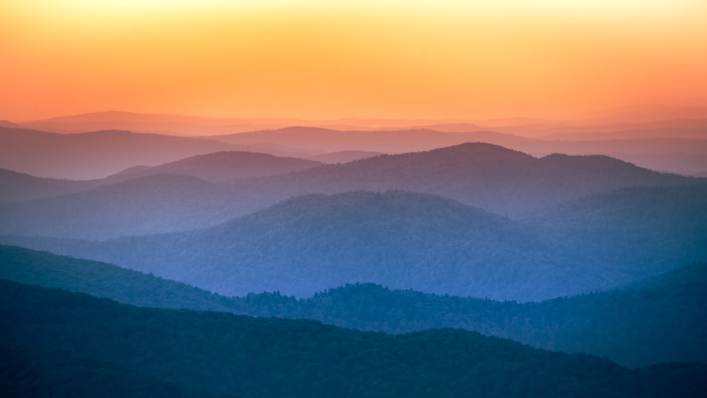 a view of a mountain range at sunset