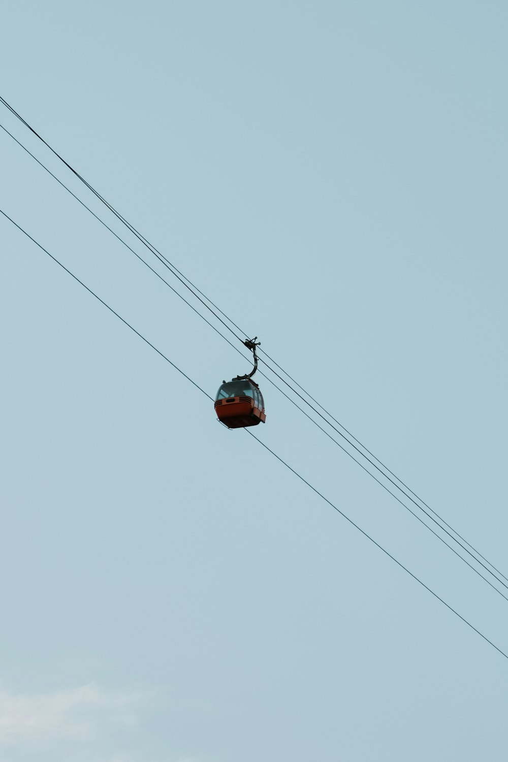 a cable car with a sky in the background