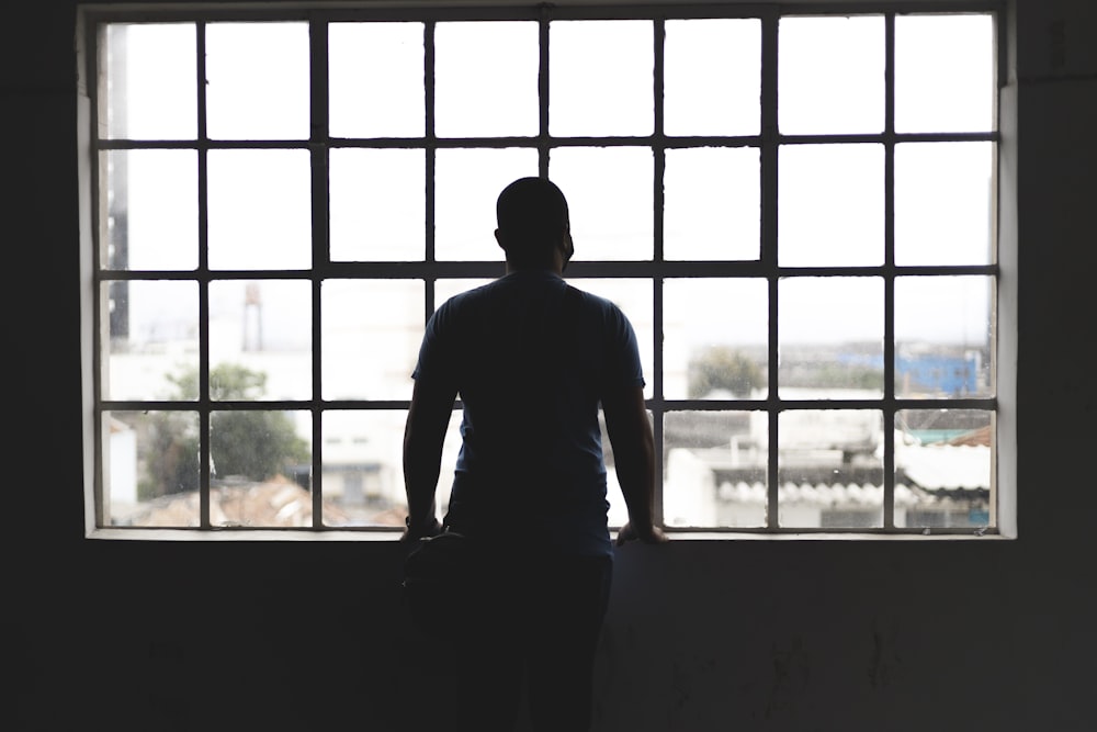 a person standing in front of a window