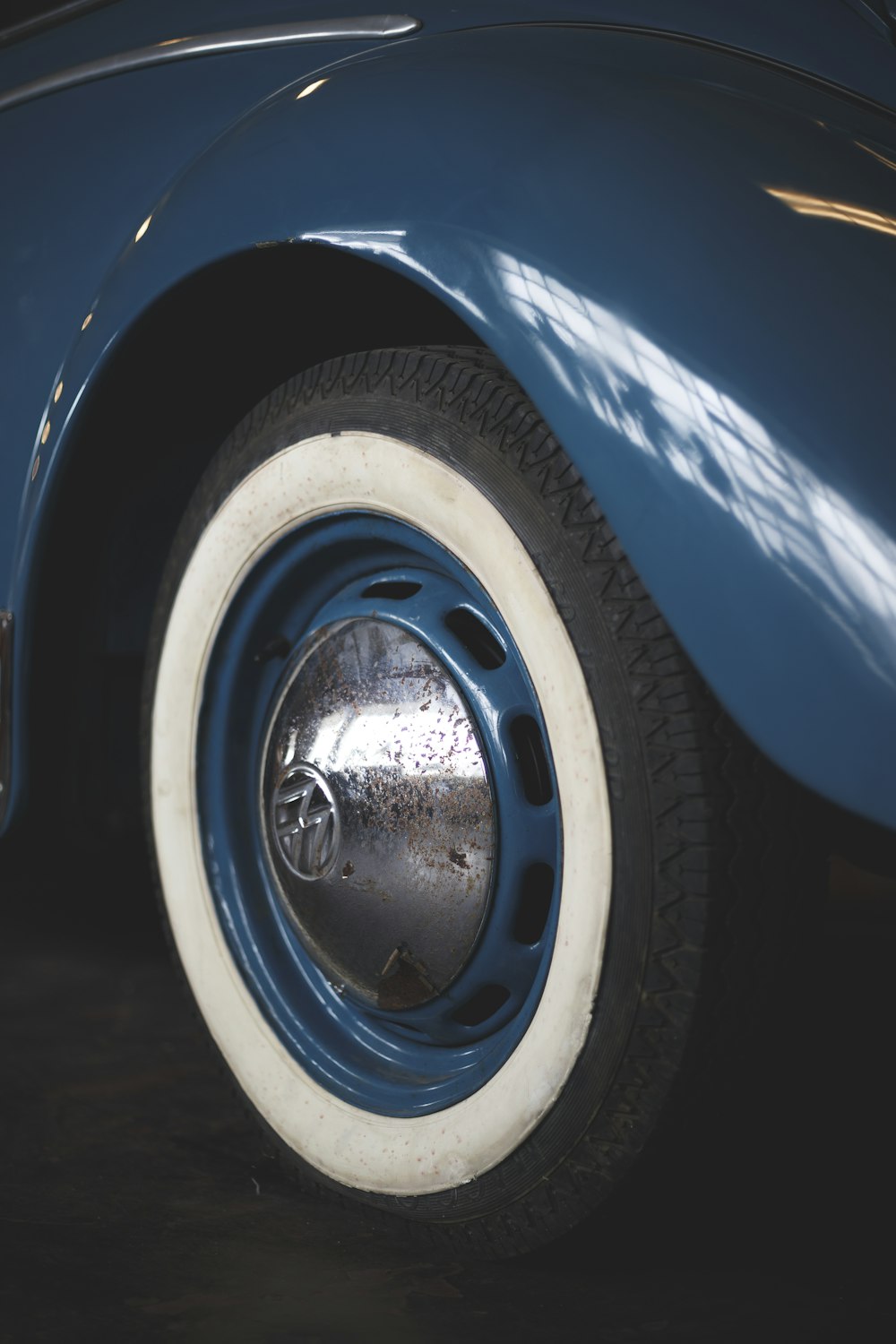 a close up of a blue and white car tire