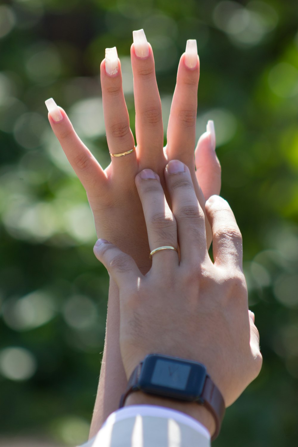 a woman's hand with a ring on it